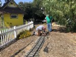 Picture Title - Wolf installing steel rail Kelley look on 