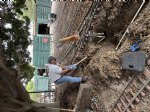 Picture Title - Rory digging ditches for the new boiler water hose bib